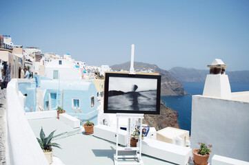 GREECE, SANTORINI: Scenic seaside landscape view of white classics buildings on the rocky slopes of...