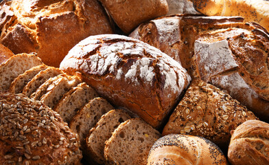 Assorted bakery products including loafs of bread and rolls