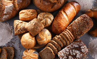 Assorted bakery products including loafs of bread and rolls