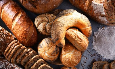Assorted bakery products including loafs of bread and rolls