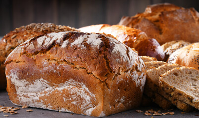 Assorted bakery products including loafs of bread and rolls