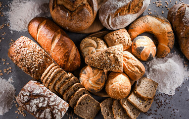 Assorted bakery products including loafs of bread and rolls