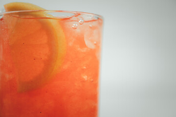 Cool fresh pink lemonade and decoration with sliced lemon