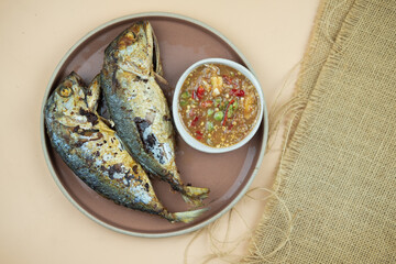 Top view fried mackerels with shrimp paste dipping sauce