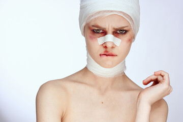 woman tampon in the nose with blood injured face isolated background