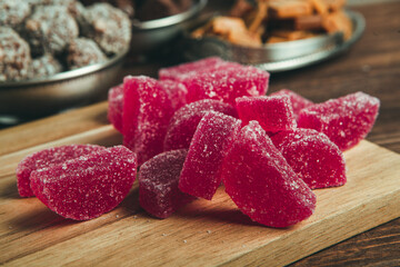 Dessert marmalade in the form of lemon and orange slices. The sweetness of jelly candy.