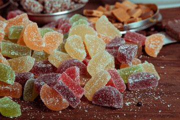 Dessert marmalade in the form of lemon and orange slices. The sweetness of jelly candy.