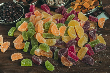 Dessert marmalade in the form of lemon and orange slices. The sweetness of jelly candy.