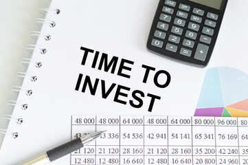 TIME TO INVEST text on paper with chart and office tools , business