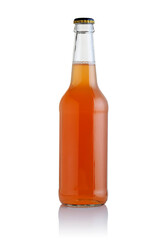 A glass bottle with an orange drink.