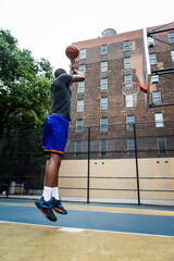 Basketball player training on a court in New york city © oneinchpunch
