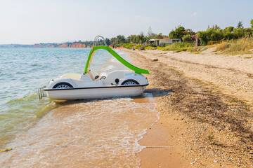 Close up view of water slide on sand coast on beautiful nature background. Greece. 