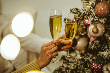 Cinematic image of a couple celebrating christmas at home.