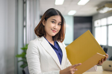 Portrait of Asian business woman is smiling in office