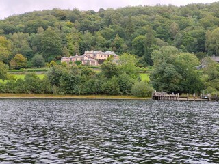 house in the mountains by a lake