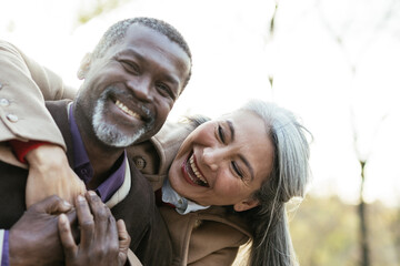 Storytelling image of a multiethnic senior couple in love - Powered by Adobe