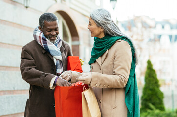 Storytelling image of a multiethnic senior couple in love