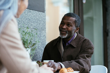 Storytelling image of a multiethnic senior couple in love