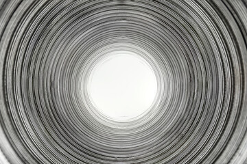 Flexible corrugated aluminum tube seen from the inside, resistant to high temperatures, isolated on...