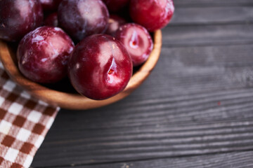 plums fruits natural products on a wooden table top view