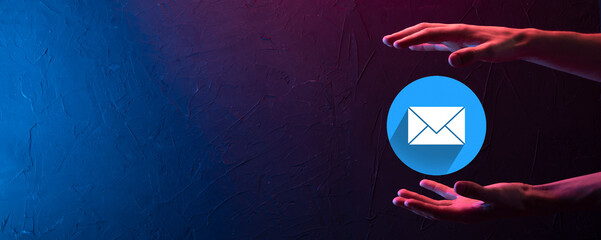 Businessman hand holding letter icon,email icons.Contact us by newsletter email and protect your...