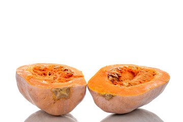 Two halves of ripe organic pumpkin, close-up, isolated on white.