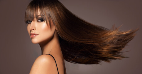 Beautiful model woman with shiny  and straight long hair. Keratin  straightening. Treatment, care...