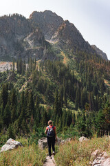 woman hiking down hiking trail