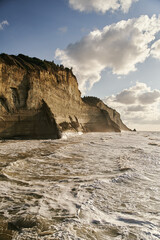 View of Logas Beach and the amazing rocky cliff in Peroulades. Corfu island. Greece