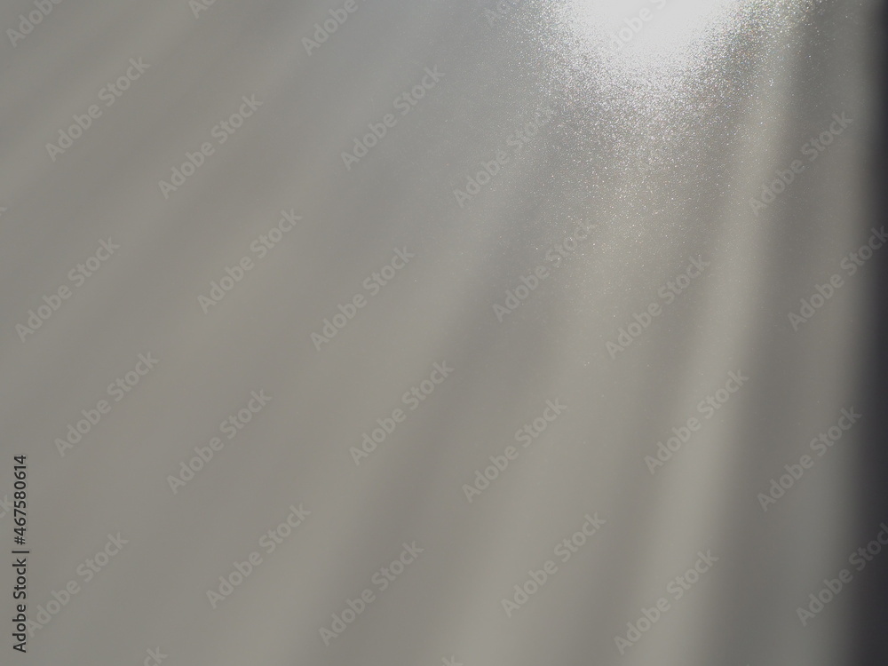 Poster diagonal rays of light on a gray background. blurred abstract background light effect, light leaks. 
