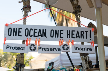 Wooden sign in favour of recycling and environmental protection. Inspiring message about the fight...