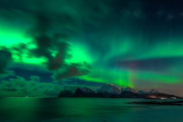 Fototapeta na wymiar Aurora Borealis, the Northern lights on sky in Lofoten islands, northern Norway