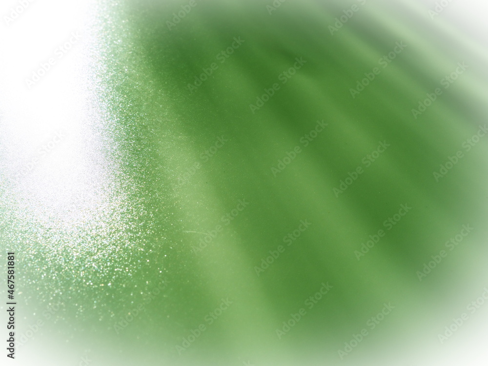 Poster diagonal rays of light on a green background. blurred abstract background light effect and leaks. si