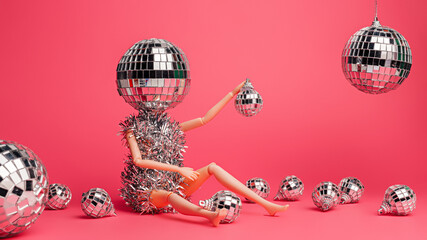 Creative Christmas party composition with doll and shiny disco balls on pink background. Minimal...