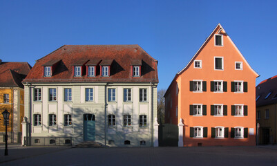 City square with a baroque school building and the gable facade of a residential house in the old town of Herrieden, Franken region in Germany