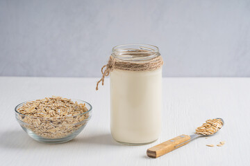 Vegetarian creamy plant-based, dairy-free oat milk made of oats grains having sweet oatmeal flavor...