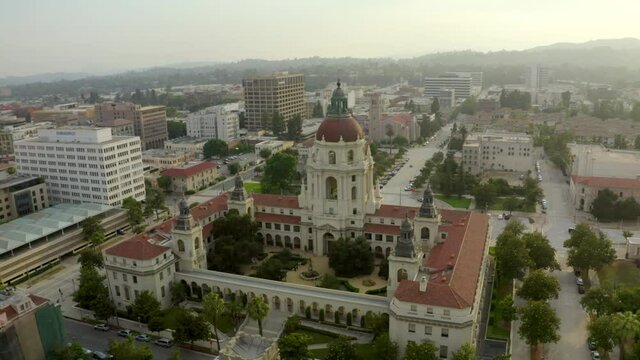 Aerial: Panning Shot Of Famous Pasadena City Hall On Landscape, Drone Flying Over Trees