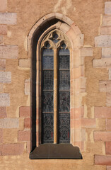 Pointed gothic window arch with tracery at the church of Our Dear Lady in the old town of Herrieden...