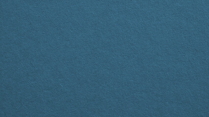 The surface of blue cardboard. Paper texture with cellulose fibers. Background with elegant tint. Paperboard wallpaper. Textured dark azure backdrop. Macro