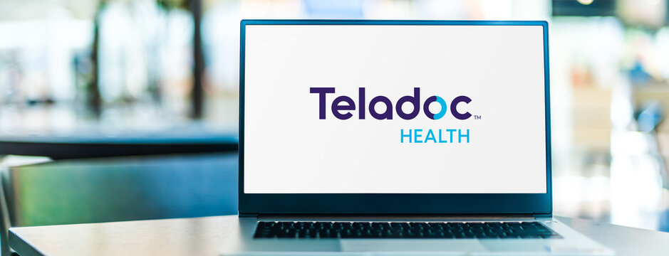 Laptop computer displaying logo of Teladoc Health