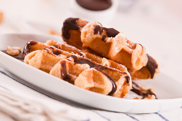 Waffles with chocolate cream and hazelnuts.