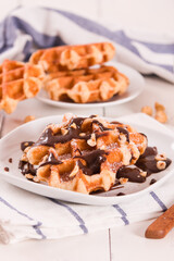 Waffles with chocolate cream and hazelnuts.