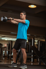 personal trainer performing a crossfit workout at gym