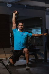 personal trainer performing a crossfit workout at gym