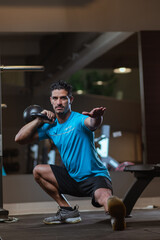 personal trainer performing a crossfit workout at gym