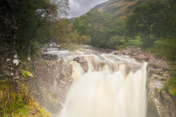 An autumnal 3 shot HDR image of the Lower falls on the River Nevis in flood after heavy rain, Fort...