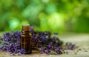 Lavender essential oil in a bottle. Selective focus.