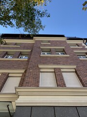 old red brick house with windows