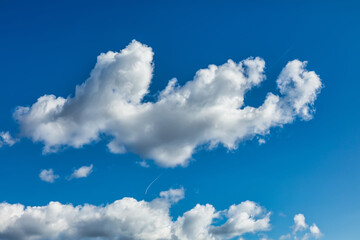Naklejka na ściany i meble blue sky with lush cumulus clouds