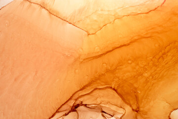 Abstract ocher ink watercolor background. Yellow orange brown paint stains and spots in water, luxury fluid liquid art wallpaper
